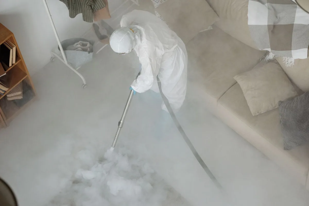 Biohazard cleanup technician in protective equipment, Carrizo Springs, TX